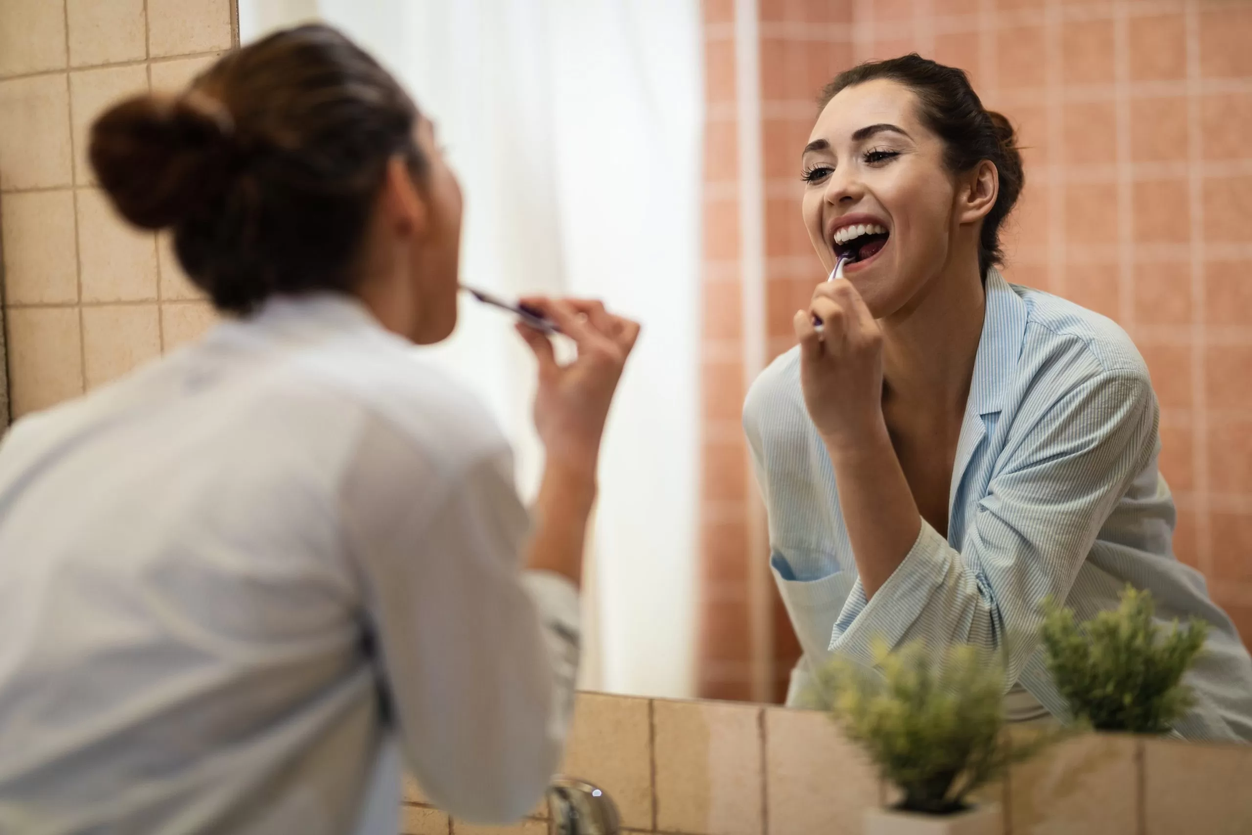 https://www.edgecliffdentalcare.com.au/wp-content/webp-express/webp-images/uploads/2023/03/reflection-mirror-young-woman-brushing-teeth-bathroom-min-scaled.jpg.webp